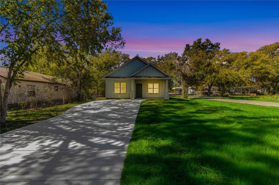 Front exterior of a new home in , Navasota, TX, highlighting curb appeal (Image 21).