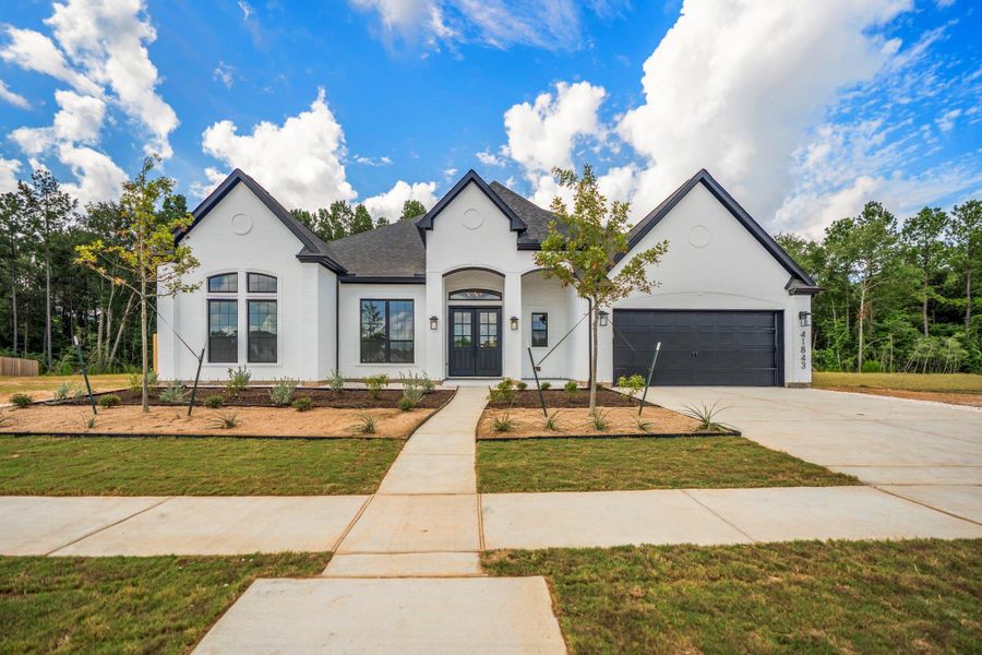 Front exterior of a new home in Colton, Todd Mission, TX, highlighting curb appeal (Image 2). Front exterior of a new home in Colton, Todd Mission, TX, highlighting curb appeal (Image 2).