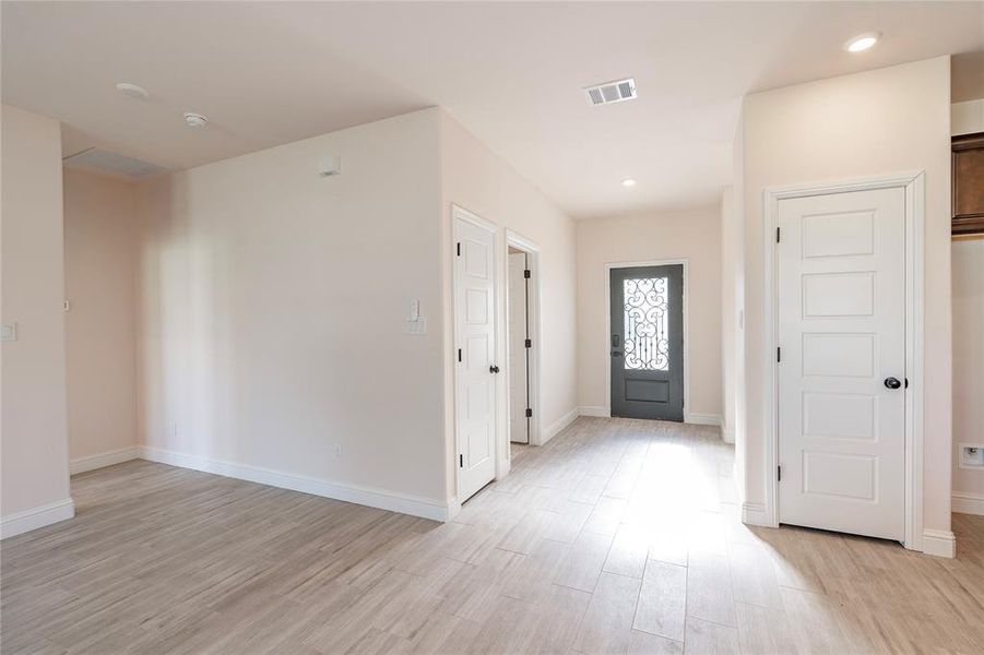 Foyer with light wood-type flooring