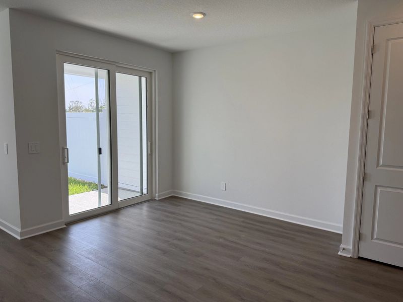Sun-filled dining space with easy access to back patio