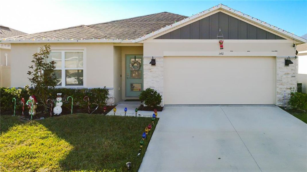 Front exterior of a new home in , St. Cloud, FL, highlighting curb appeal (Image 26).