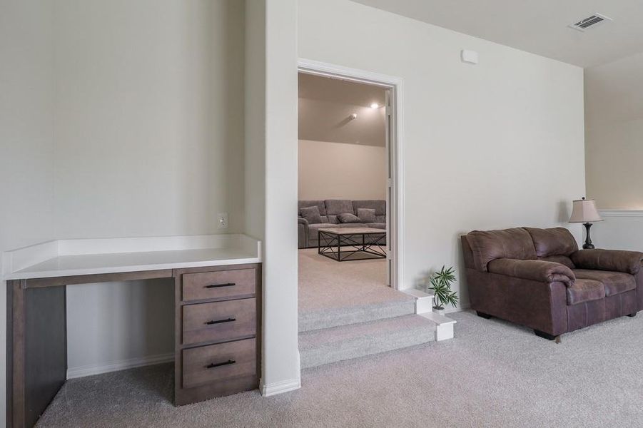 Upstairs living area, office nook and media entrancw