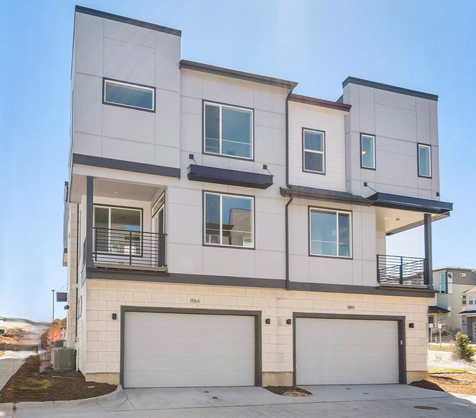 Front exterior of a new home in Lyric at RidgeGate Townhomes, Lone Tree, CO, highlighting curb appeal (Image 2). Front exterior of a new home in Lyric at RidgeGate Townhomes, Lone Tree, CO, highlighting curb appeal (Image 2).