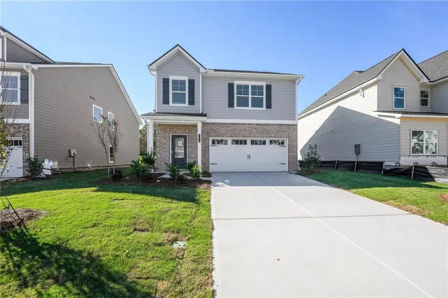 Front exterior of a new home in Neely Farm, Covington, GA, highlighting curb appeal (Image 16). Front exterior of a new home in Neely Farm, Covington, GA, highlighting curb appeal (Image 16).