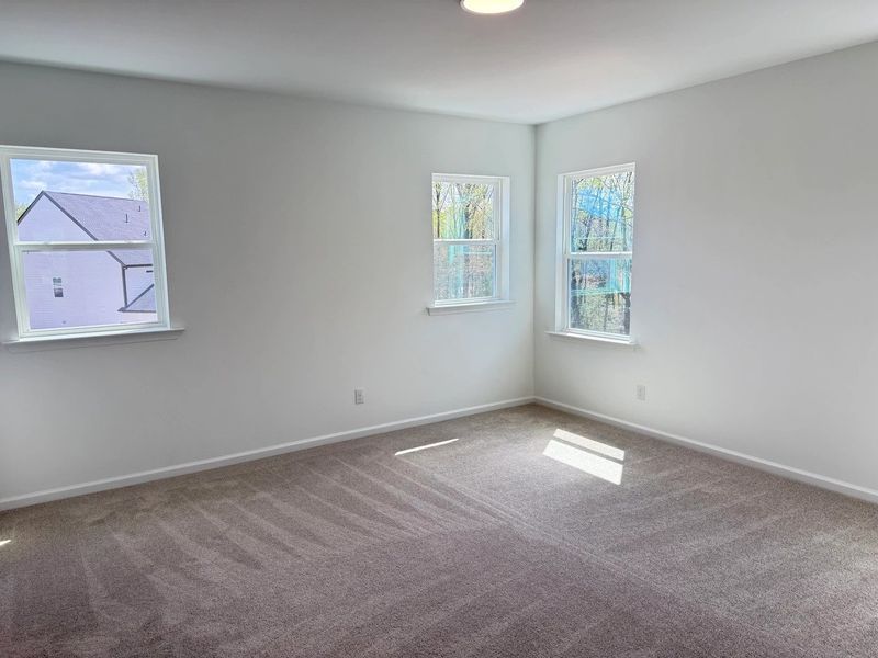 Spacious, unfurnished interior of a new home in Rowland's Grant, Fuquay Varina (Image 24).