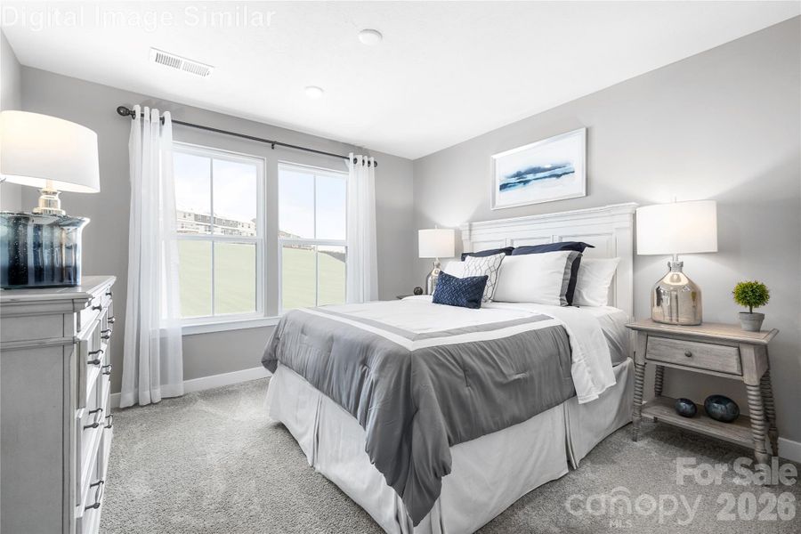 Comfortably sized guest bedroom with two large windows—bright, inviting, and ready to be styled to suit any taste. Comfortably sized guest bedroom with two large windows—bright, inviting, and ready to be styled to suit any taste.