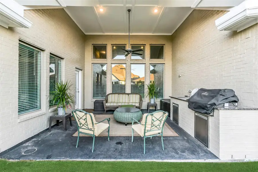 Exterior details and patio area of a home in ARTAVIA 65', Conroe (Image 2).