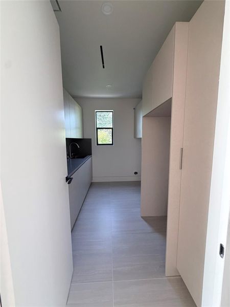 Second floor laundry room with space for 36" fridge