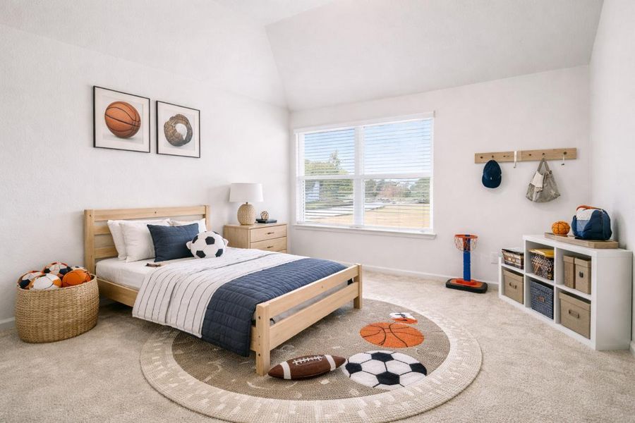 Cozy upstairs bedroom staged with charming finishes and playful decor.