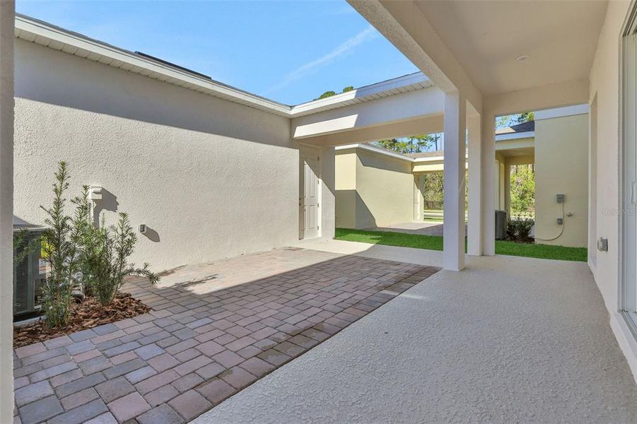 Exterior details and patio area of a home in Serenade at Ovation, Winter Garden (Image 3).