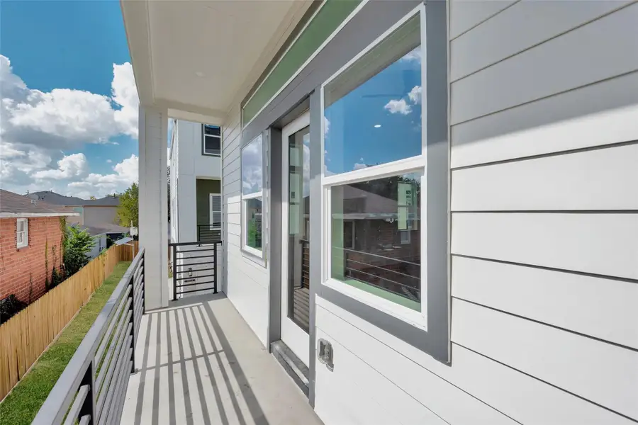 In addition to the backyard, the covered balcony that runs the entire width of the home is a great space to enjoy the outdoors.