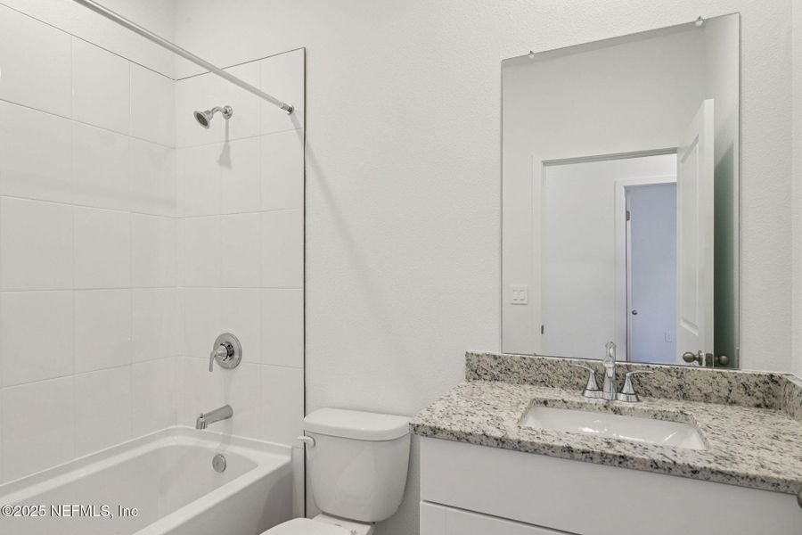 Furnished interior view inside a new home in Lakes at Bella Lago - Signature Series, Green Cove Springs (Image 6). Furnished interior view inside a new home in Lakes at Bella Lago - Signature Series, Green Cove Springs (Image 6).