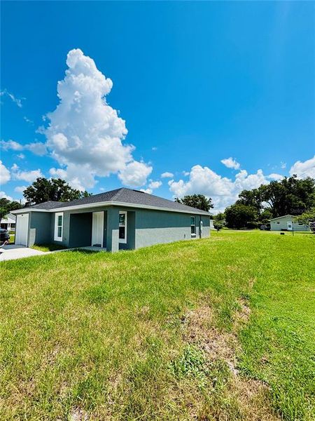 Front exterior of a new home in , Bartow, FL, highlighting curb appeal (Image 15).