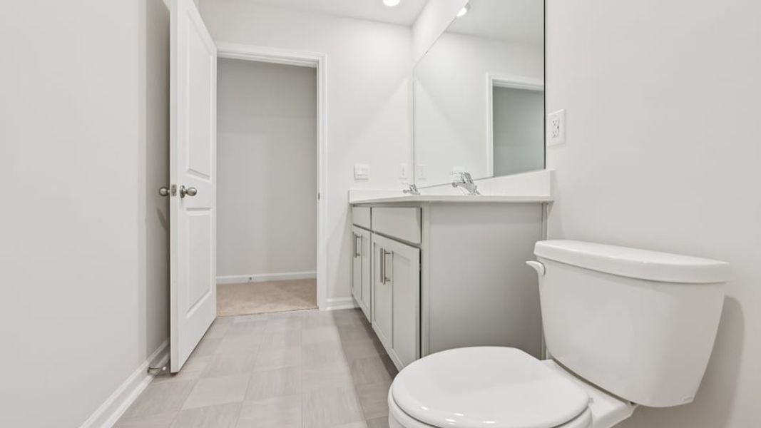 Furnished interior view inside a new home in Gretchen Pines, West End (Image 9).