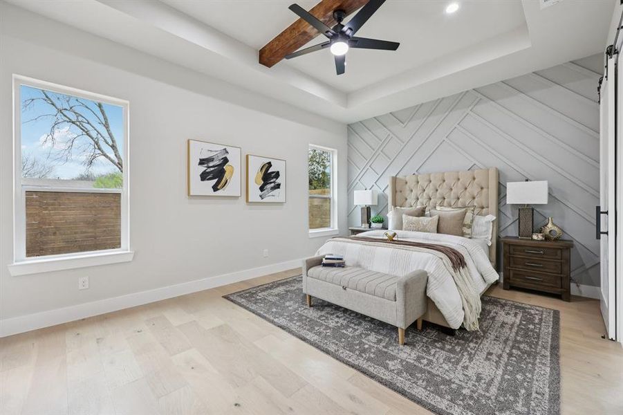 Light wood-finish flooring with a decorative accent wall