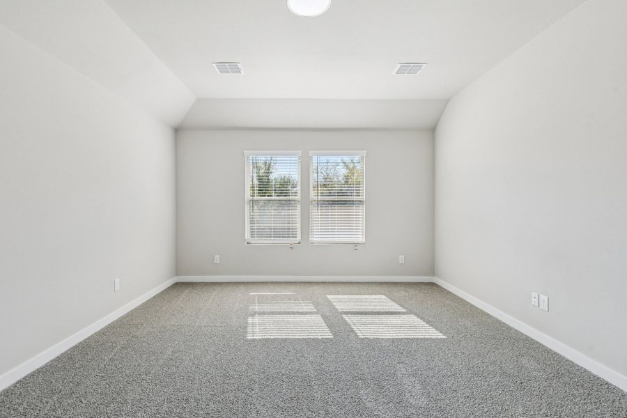 Primary Suite in the Heisman home plan by Trophy Signature Homes – REPRESENTATIVE PHOTO Primary Suite in the Heisman home plan by Trophy Signature Homes – REPRESENTATIVE PHOTO