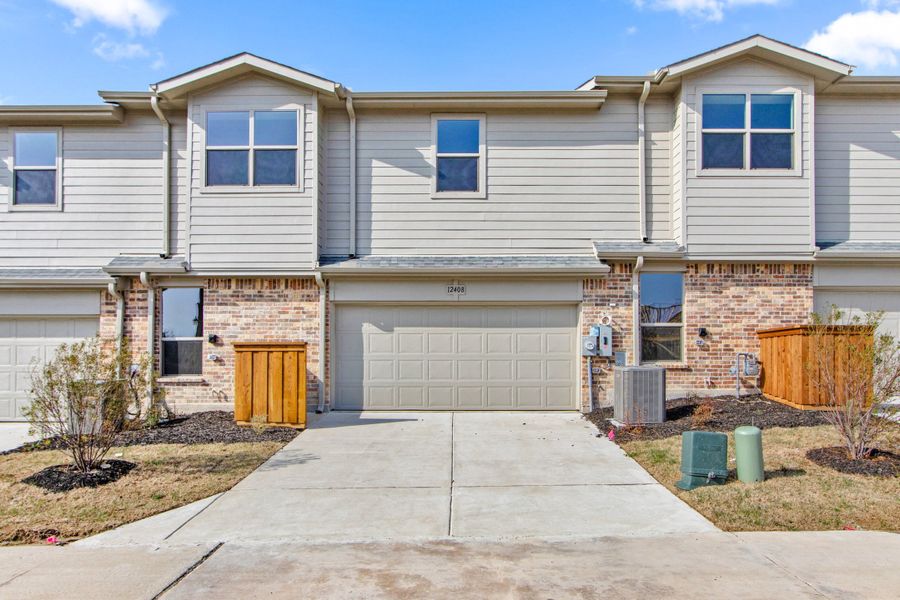 Front exterior of a new home in Cottonwood Creek, Rowlett, TX, highlighting curb appeal (Image 18).