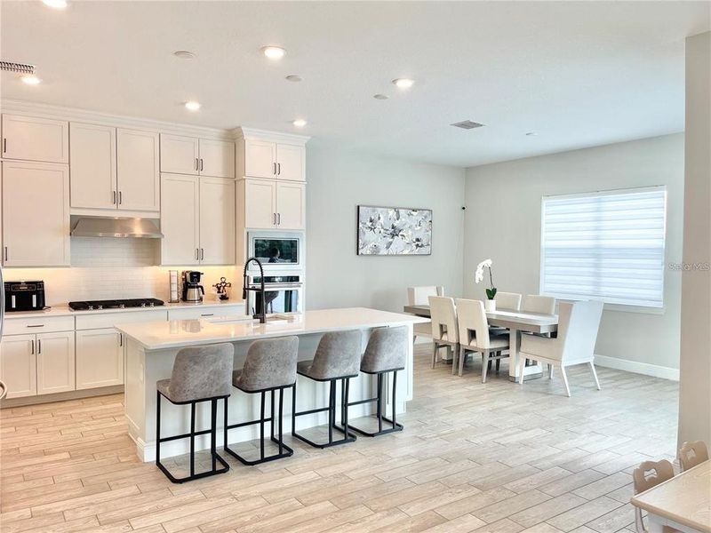 Furnished interior view inside a new home in Parkview Reserve, Orlando (Image 10).