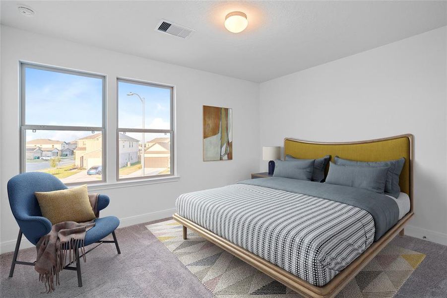 Secondary bedroom features plush carpet, neutral paint, lighting, windows and ample sized closet space.