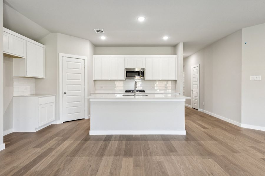 Kitchen in the Emmy II home plan by Trophy Signature Homes - REPRESENTATIVE PHOTO Kitchen in the Emmy II home plan by Trophy Signature Homes - REPRESENTATIVE PHOTO