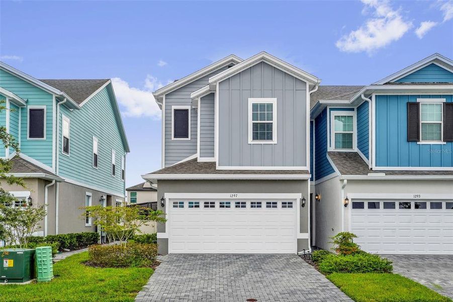 Front exterior of a new home in Brixton, St. Cloud, FL, highlighting curb appeal (Image 2). Front exterior of a new home in Brixton, St. Cloud, FL, highlighting curb appeal (Image 2).
