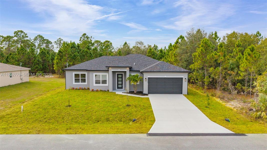 Front exterior of a new home in , Palm Bay, FL, highlighting curb appeal (Image 2). Front exterior of a new home in , Palm Bay, FL, highlighting curb appeal (Image 2).