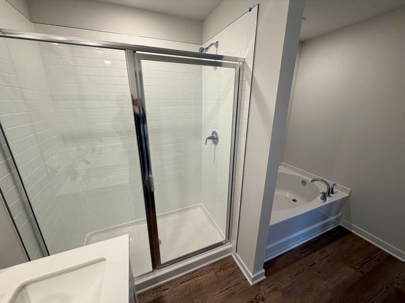 A bathroom with a glass shower. A bathroom with a glass shower.