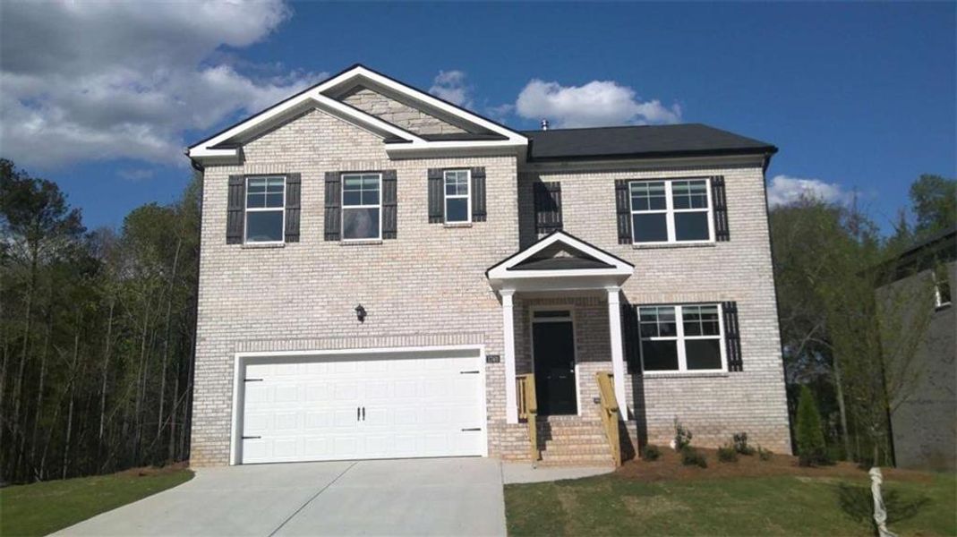 Front exterior of a new home in The Reserve at Calcutta, Stockbridge, GA, highlighting curb appeal (Image 27).