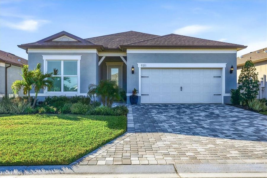 Front exterior of a new home in , Parrish, FL, highlighting curb appeal (Image 1). Front exterior of a new home in , Parrish, FL, highlighting curb appeal (Image 1).
