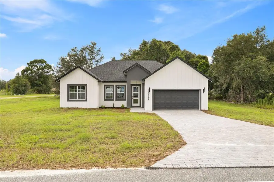 Front exterior of a new home in , Ocala, FL, highlighting curb appeal (Image 26). Front exterior of a new home in , Ocala, FL, highlighting curb appeal (Image 26).