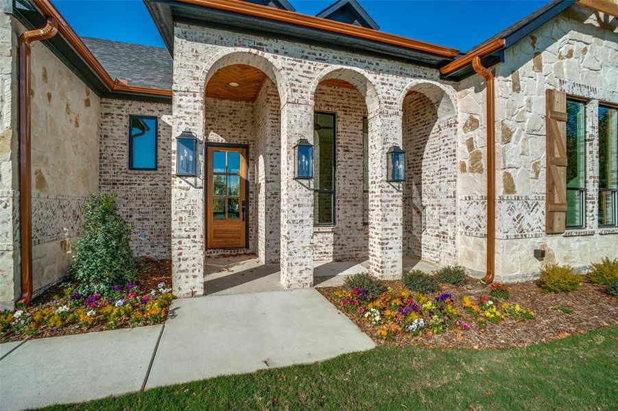 Doorway to property with brick siding, stone siding, and crawl space Doorway to property with brick siding, stone siding, and crawl space