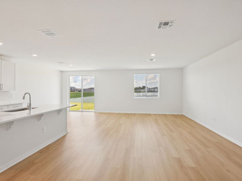 Spacious, unfurnished interior of a new home in The Grove at Stuart Crossing - Classic Series, Bartow (Image 3).