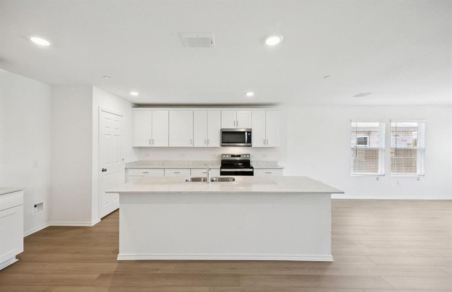 Kitchen featuring a large island ideal for informal dining and gatherings *Real home pictured Kitchen featuring a large island ideal for informal dining and gatherings *Real home pictured