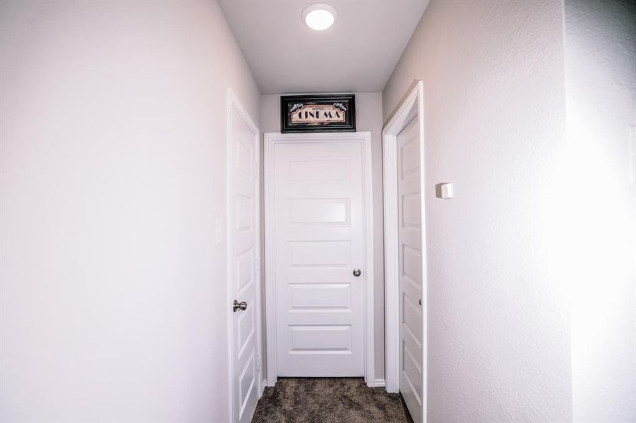 Hall with dark colored carpet