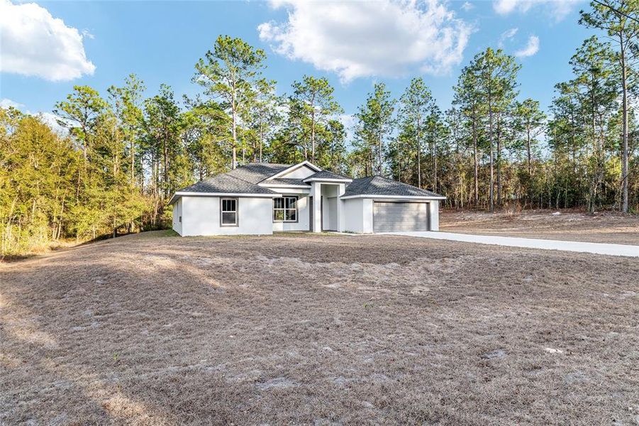 Front exterior of a new home in , Dunnellon, FL, highlighting curb appeal (Image 32).