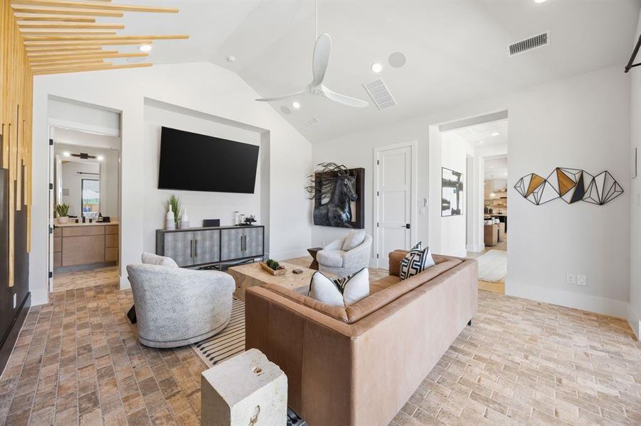 This first floor entertainment room has slider doors that open out onto a covered patio with kitchen and a bathroom--perfect for all season indoor/outdoor entertaining. This space is also right next to the first floor guest suite, so it could be used as a multi-gen living suite. This first floor entertainment room has slider doors that open out onto a covered patio with kitchen and a bathroom--perfect for all season indoor/outdoor entertaining. This space is also right next to the first floor guest suite, so it could be used as a multi-gen living suite.