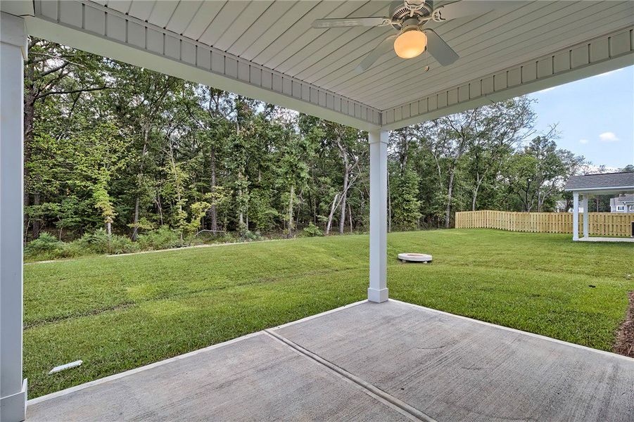 Enjoy the peaceful backyard with mature trees and