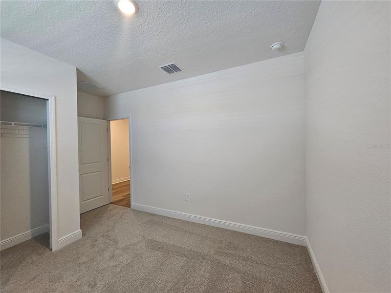 Spacious, unfurnished interior of a new home in The Reserve at Hammock Oaks - Signature Series, Lady Lake (Image 33).