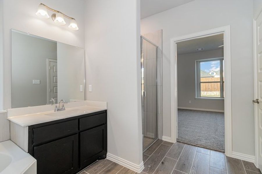 Furnished interior view inside a new home in Mustang Place II, Heartland (Image 10).