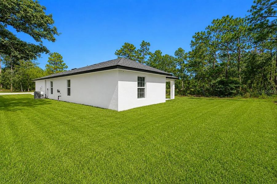 Exterior details and patio area of a home in , Brooksville (Image 29). Exterior details and patio area of a home in , Brooksville (Image 29).