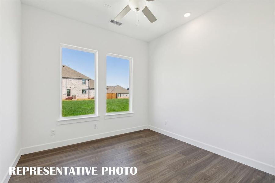 The professional needing to work from home will appreciate this light filled, private home office.  REPRESENTATIVE PHOTO