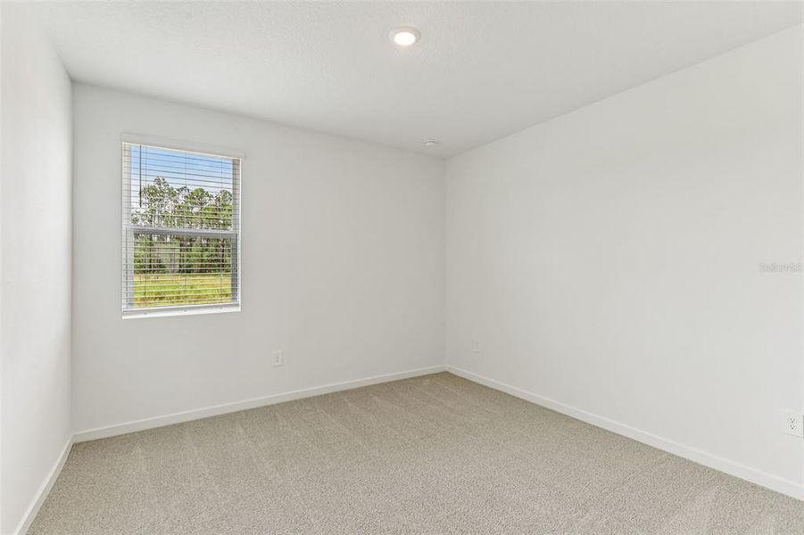 Spacious, unfurnished interior of a new home in Colbert Landings, Palm Coast (Image 29).