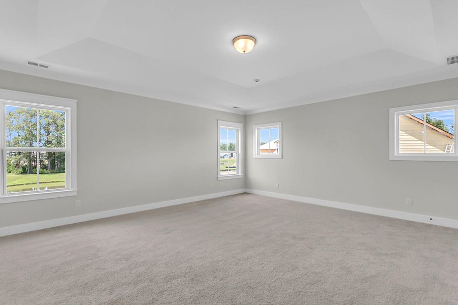 Spacious, unfurnished interior of a new home in Tidewater at Lakes of Cane Bay, Summerville (Image 22).