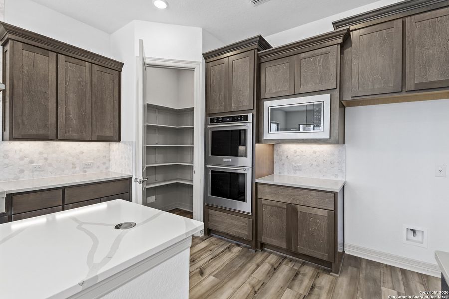 Furnished interior view inside a new home in Highland Estates, San Antonio (Image 7).