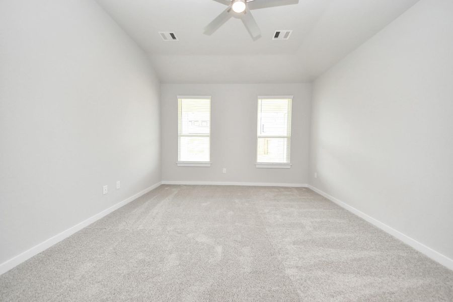 Another perspective unveils a comprehensive view of the serenity and comfort this primary suite offers. Another perspective unveils a comprehensive view of the serenity and comfort this primary suite offers.