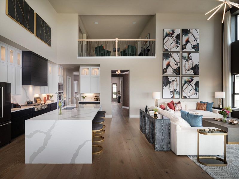 Living area with dark wood-style floors and a high ceiling Living area with dark wood-style floors and a high ceiling