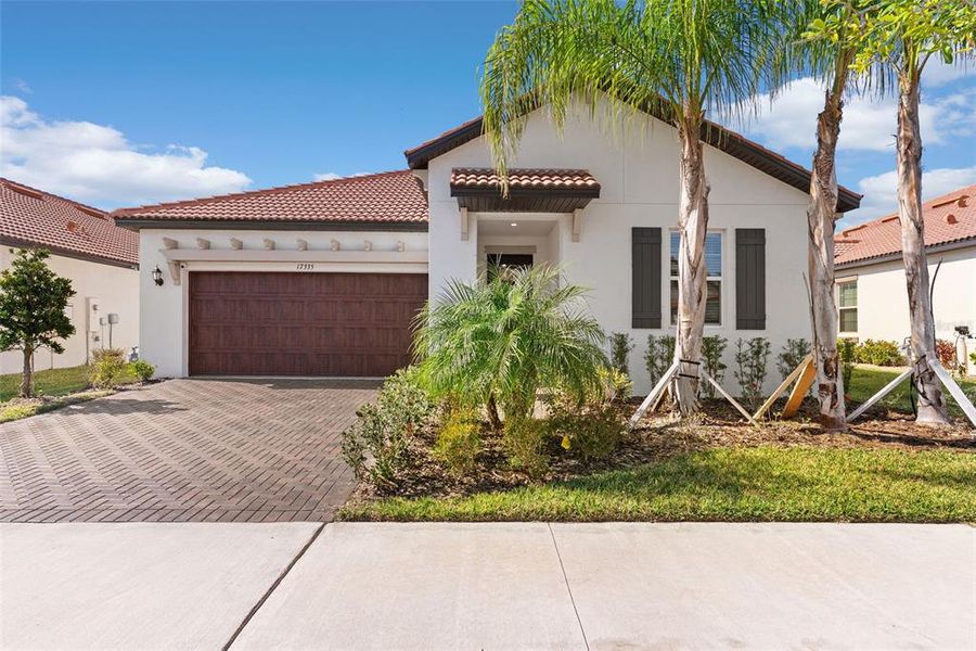 Front exterior of a new home in Southshore Bay Active Adult, Wimauma, FL, highlighting curb appeal (Image 1). Front exterior of a new home in Southshore Bay Active Adult, Wimauma, FL, highlighting curb appeal (Image 1).