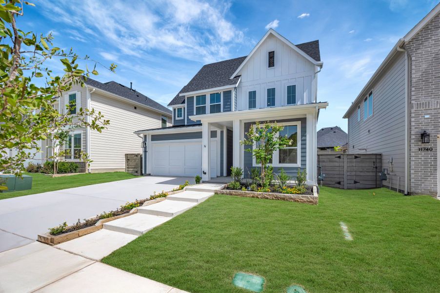 Front exterior of a new home in Treeline, Justin, TX, highlighting curb appeal (Image 2). Front exterior of a new home in Treeline, Justin, TX, highlighting curb appeal (Image 2).