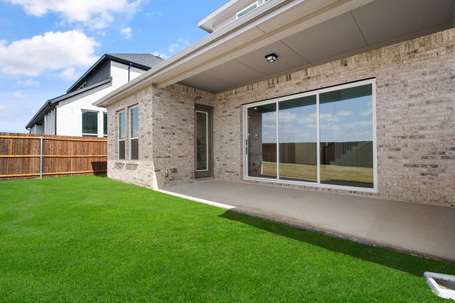 Exterior details and patio area of a home in Lake Breeze, Lavon (Image 4).