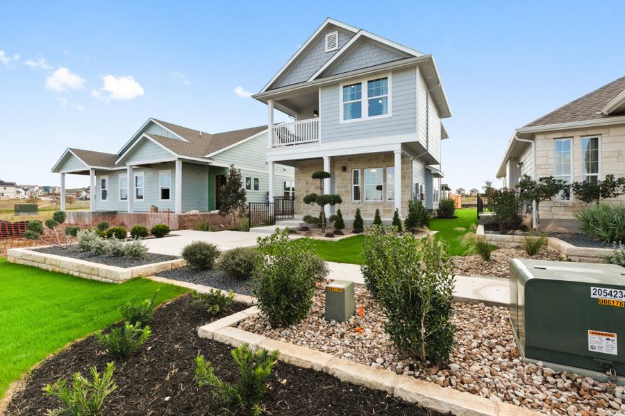 Front exterior of a new home in Whisper Valley, Manor, TX, highlighting curb appeal (Image 2).